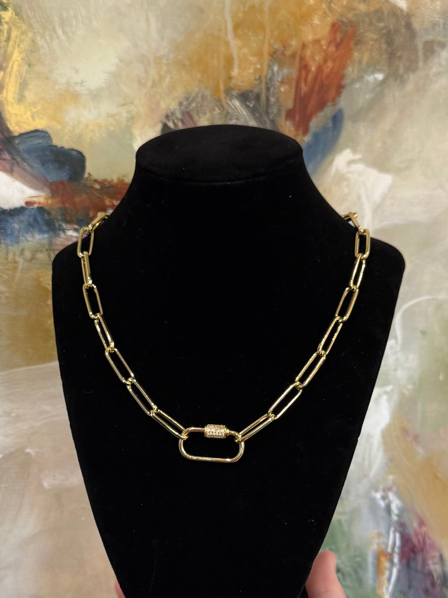 All gold paper clip Leslie